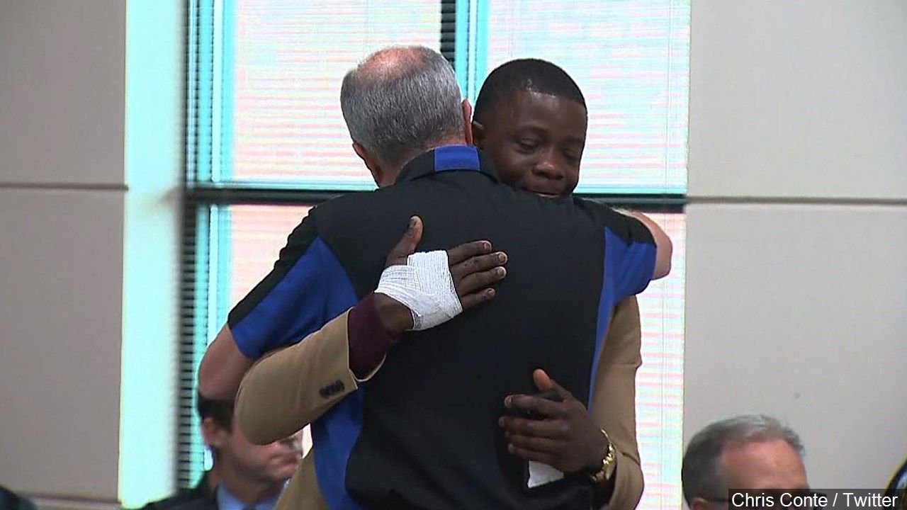 Walt Ehmer, the CEO of Waffle House hugs James Shaw and calls him his "hero." James Shaw Jr. is the hero customer rushed Waffle House killer Travis Reinking and ripped away his assault-style rifle, Photo Date: 4/22/18